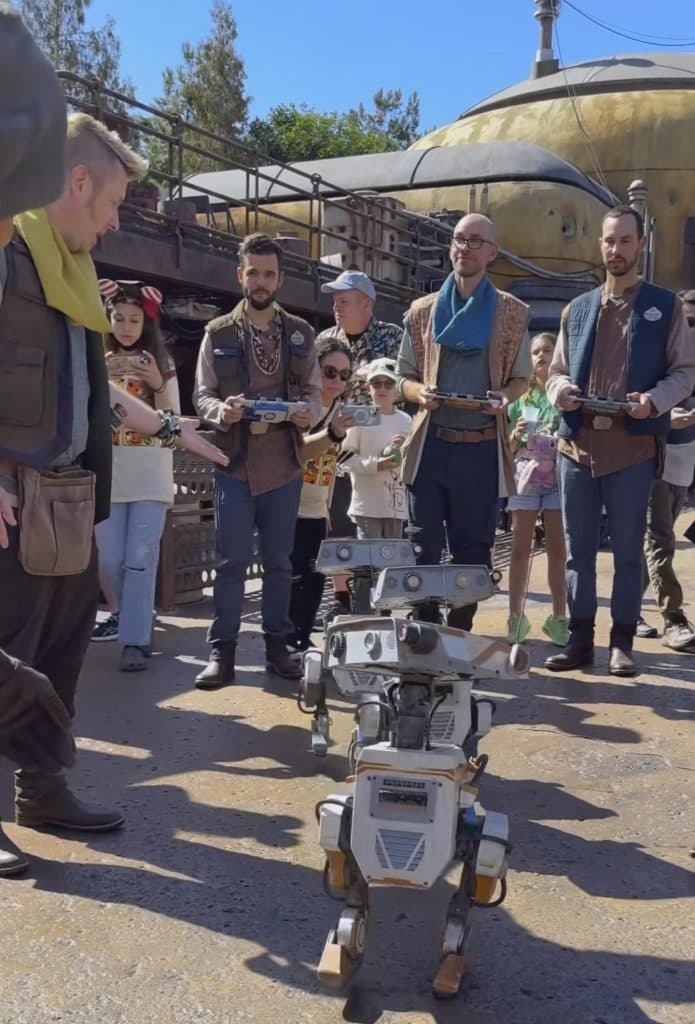 Droids being controlled by Steam Decks at Disneyland full image 